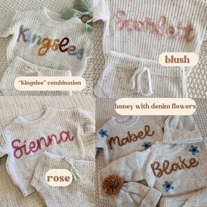 May include: A collection of cream-colored speckled knit sweaters and matching shorts sets. Each sweater features embroidered names including Kingslee, Scarlett, Sienna, Mabel, and Blake in various yarn colors. Some sets include matching knit hats.