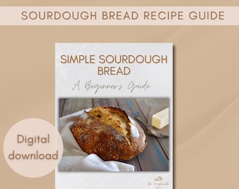 Puede incluir: Una guía digital descargable para hacer pan de masa madre. La portada presenta un primer plano de una hogaza de pan de masa madre recién horneada sobre un paño de lino blanco, con una porción de mantequilla sobre una superficie de madera. El título dice "Simple Sourdough Bread: A Beginner's Guide".