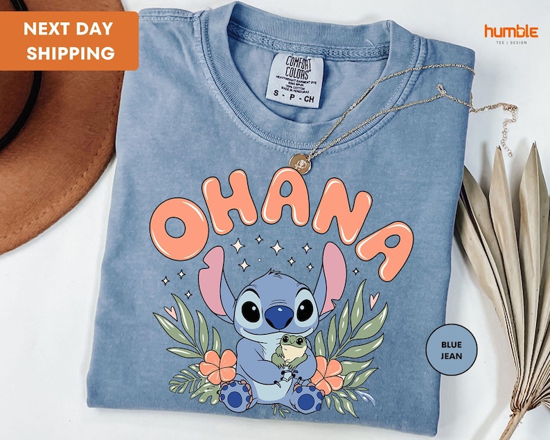 a blue t - shirt with an image of a stitch stitch stitch stitch stitch stitch