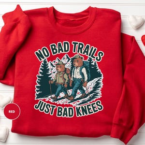 a red shirt with a picture of two people on it