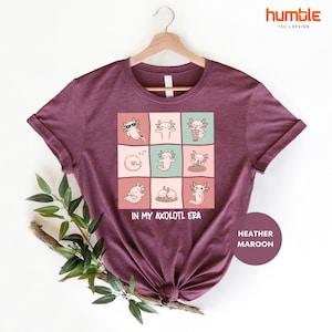 a t - shirt with a picture of cats on it