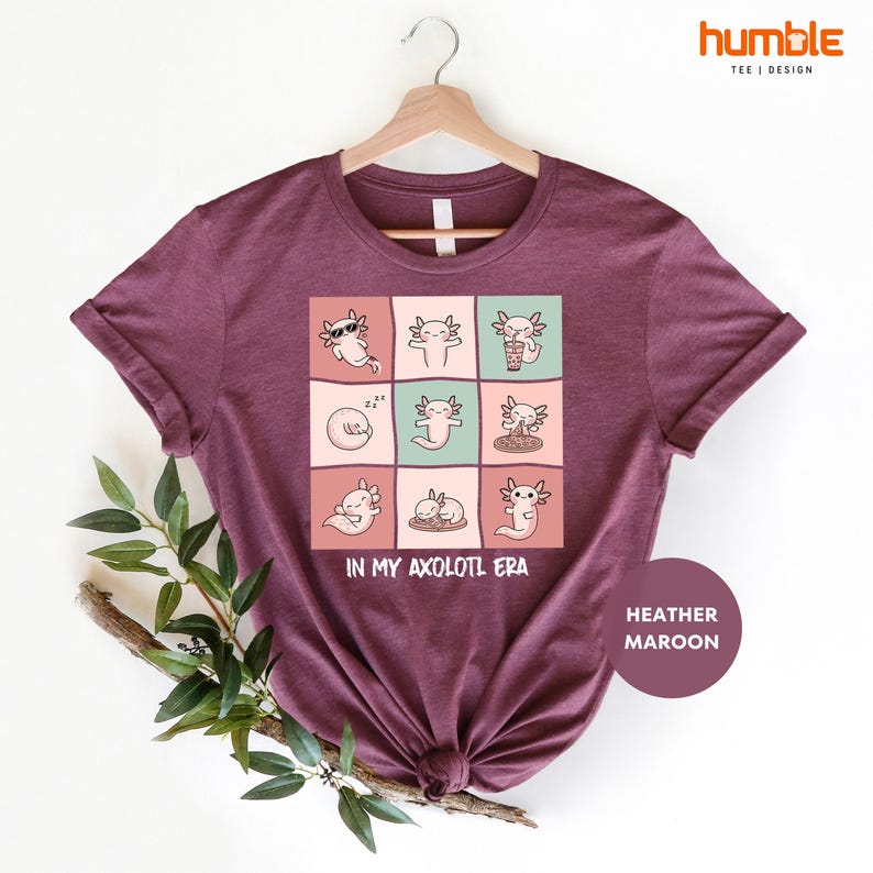 a t - shirt with a picture of cats on it