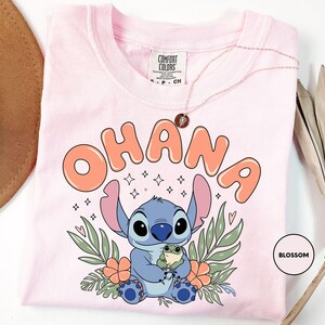 a pink shirt with an image of stitch stitch stitch stitch stitch stitch stitch stitch stitch
