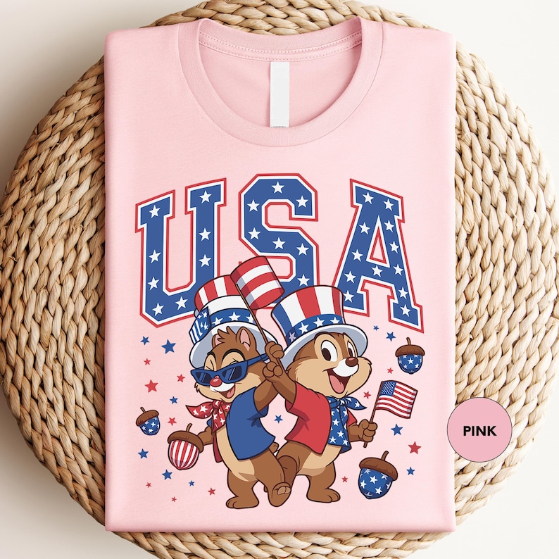 a pink t - shirt with a picture of two bears on it