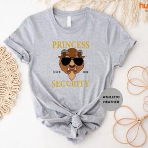 a t - shirt with a picture of a bear wearing sunglasses
