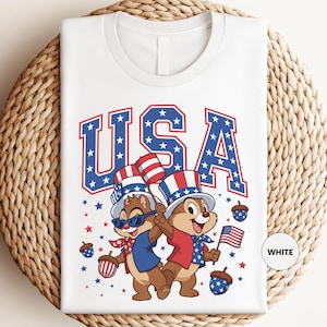 a white t - shirt with a picture of two bears on it