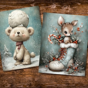 May include: Two winter-themed art prints. One features a teddy bear with a snowball on its head, wearing a scarf, in a snowy scene. The other shows a fawn in a winter boot with a candy cane and holly. Both have a soft, watercolor style.