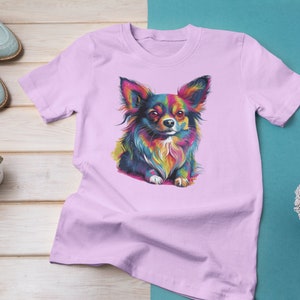 Vibrant Pop Art Long-Hair Chihuahua graphic of a fun and colorful design for any dog lover printed on a pink short sleeve shirt.