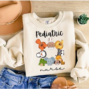 Kinder Krankenschwester Sweatshirt, Kinder Krankenschwester Shirt, Pädiatrie Crewneck, Kinder Krankenschwester Geschenk, Krankenschwester Wertschätzung Geschenk, Pädiatrie Krankenschwester Sweatshirt