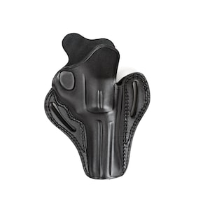 Peut inclure: Étui en cuir noir pour une arme à feu. L'étui est doté d'une boucle de ceinture et d'une fermeture à pression.