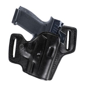 May include: A black leather holster with a black handgun. The holster has a molded design with reinforced stitching and belt loops. The handgun is black with a textured grip and slide.