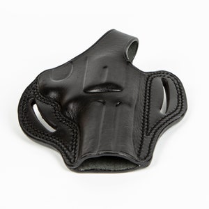 May include: A black leather holster for a handgun. The holster has a belt loop and a thumb break.