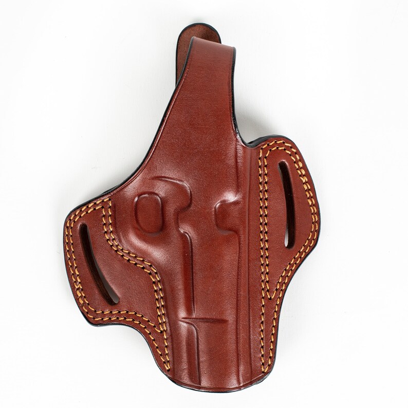 May include: A brown leather holster with a belt loop and stitching detail.