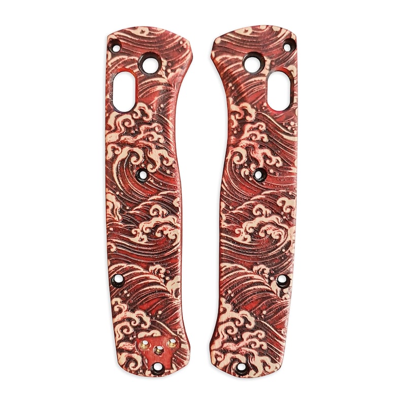 May include: A pair of red and cream colored knife scales with a wave pattern. The scales are made of a durable material and are designed to fit a variety of knife models.