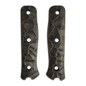 May include: Two brown and black patterned knife handles with three holes each.