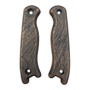 May include: Two brown wood-grain textured knife handles with black accents and a hole in the top.