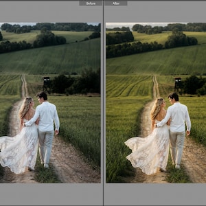 May include: A couple walking on a dirt path through a green field. One person wears a long white lace dress with a flowing skirt, and the other wears a white button-down shirt with light-colored trousers. The scene is captured in natural outdoor light.