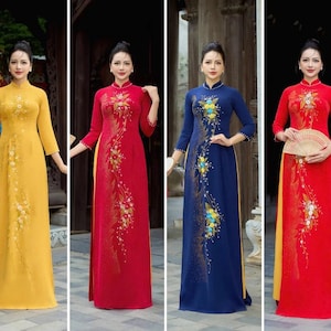 Preconfeziona il tradizionale Ao Dai vietnamita, l'abito ao dai, ao dai ba sui della mamma con pantaloni per la festa di nozze ao dai della mamma, quindi đính kết.
