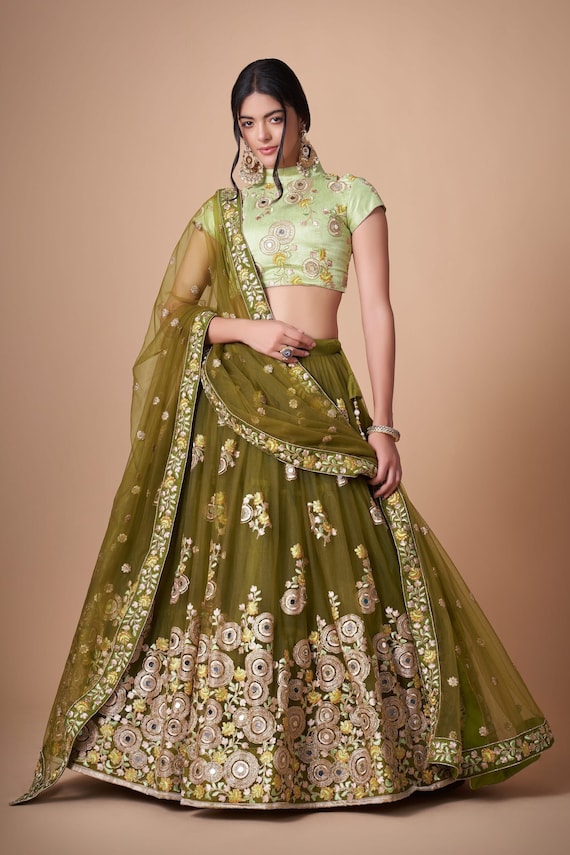 Mehndi Lehenga : A Tapestry of Tradition and Elegance.