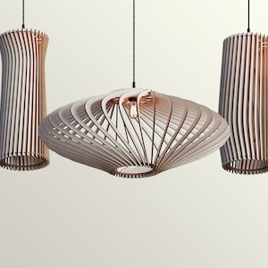 May include: Three modern wooden pendant lights hanging from the ceiling. The lights are made of thin strips of wood that are curved and woven together to create a unique and stylish design. The lights are all different shapes and sizes, with one being a large, flat disc and the other two being cylindrical.