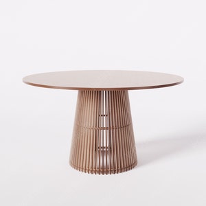 May include: A round wooden dining table with a slatted base. The table top is brown and the base is a light brown color.