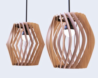 May include: Two wooden pendant lights with a geometric design. The lights are made of thin strips of wood that are woven together to create a unique and modern look.