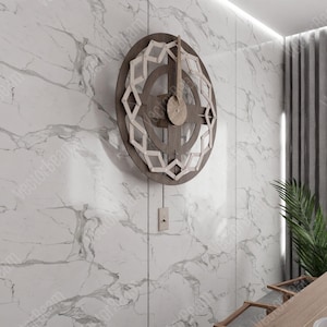 Puede incluir: Un reloj de madera con un dise&ntilde;o geom&eacute;trico cuelga de una pared de m&aacute;rmol blanco. El reloj tiene una esfera circular con un dise&ntilde;o en blanco y negro y una sola aguja.