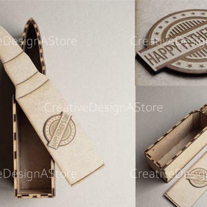 Puede incluir: Una caja de madera con forma de bala con una tapa que tiene las palabras "Happy Father's Day" en ella. La caja está abierta y la tapa está puesta al lado.