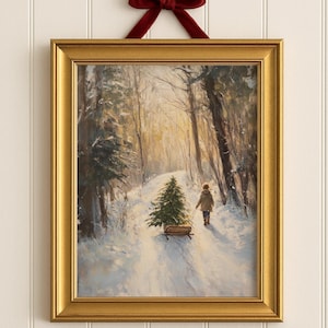 May include: A framed art print with a winter scene of a person pulling a Christmas tree on a sled through a snowy forest. The artwork is in a gold frame and is suspended by a red velvet bow. The text "THYMA NOVO Curated Art Prints" is at the bottom.