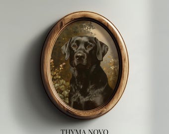May include: An oval-shaped wooden frame containing a portrait of a black Labrador retriever. The dog is positioned against a soft-focus background of muted green foliage and small white flowers. Below the frame, the text reads THYMA NOVO Curated Art Prints.