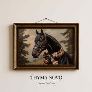 May include: A framed art print featuring a black horse with a plaid bow and bridle. The horse is set against a backdrop of trees and a cloudy sky. The frame is a dark, ornate gold color. The text "THYMA NOVO Curated Art Prints" is at the bottom.