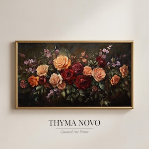 May include: A framed floral art print featuring a vibrant arrangement of roses in shades of red, orange, and cream, set against a dark, moody background. The artwork is signed "THYMA NOVO" with "Curated Art Prints" below.