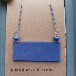 Handmade lilac stained glass and lampwork bead pendant necklace combined with stainless steel chain.