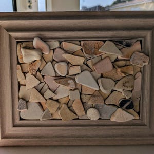 Handmade upcycled vintage mudlark found sea pottery picture.