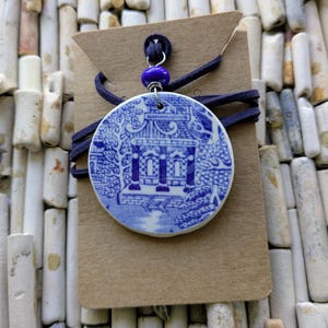 Handmade upcycled vintage willoware plate pendant necklace featuring a pagoda combined with adjustable blue cord.