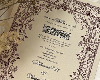May include: A decorative marriage certificate with an ornate floral border. The text reads "This agreement was made on 17th May 2023 corresponding to 24th Shawwal 1444 to certify the marriage of Mohammed Ali & Khadija Khanom. Groom Bride."