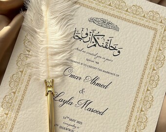 May include: A white and gold wedding certificate with an Arabic inscription, the text "And we created you in pairs", the names "Omar Ahmed & Layla Masood", and the date "14th May 2023, Corresponding to 14th Shawwal 1444AH".