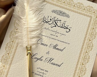 May include: A white and gold wedding certificate with an Arabic inscription, the text "And we created you in pairs", and the names "Omar Ahmed & Layla Masood". The certificate is dated May 14th, 2023, corresponding to the 14th of Shawwal 1444AH.