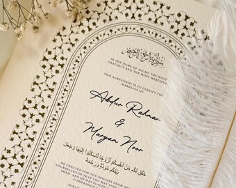 May include: A wedding invitation with an ornate border and Arabic text. The invitation is for Abdur Rahman and Maryam Noor and is dated Saturday, 15th January 2024, corresponding to 1st Rajab 1445AH.
