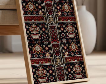 May include: A framed print with a detailed, patterned design. The artwork features a dark background with red, gold, and white geometric shapes and floral motifs. The frame is made of light-colored wood, and the print is leaning against a chair.