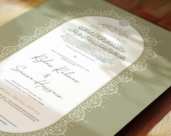 May include: A wedding certificate with a sage green border and a decorative white lace-like design. The certificate includes Arabic script and English text, with the names 'Ryhan Rahman & Sanna Hussain' prominently displayed.