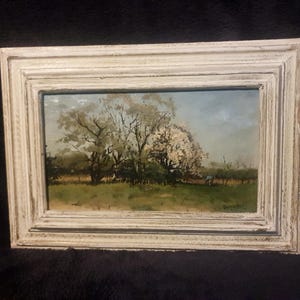 Antiek olie verf schilderij. Een mooi Tuin landschap met arbeider