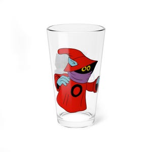 May include: A clear pint glass featuring a cartoon character in a red robe and hat, with a purple face covering and blue gloves. The character has yellow eyes and a black 'O' on the chest. The glass is empty.