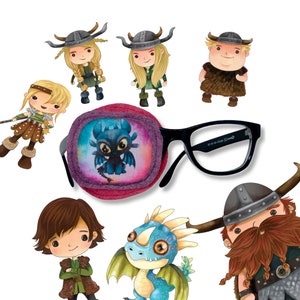 May include: A pink eye patch with a purple and blue dragon design. The eye patch is next to a pair of black framed glasses. There are several cartoon characters in the background, including a dragon and a viking.