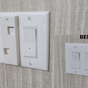 May include: Before and after image of a wall with two white light switches. The before image shows two separate switches. The after image shows the two switches combined into one double switch.