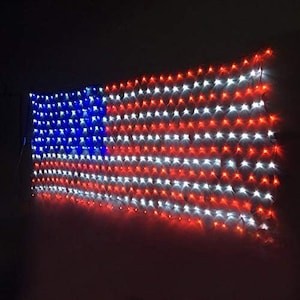 May include: A string of red, white, and blue LED lights shaped like an American flag. The lights are strung together in a grid pattern.