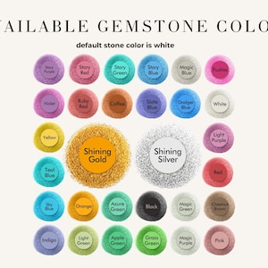 May include: Image showcasing a variety of gemstone colors, including Story Purple, Stary Red, and Teal Blue. The text "AVAILABLE GEMSTONE COLORS" is at the top, with "default stone color is white" below it. The image features a range of colors.