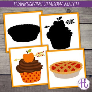May include: A Thanksgiving shadow matching game with four cards. Two cards show a pie and a cupcake with an apple and arrow on top. The other two cards show the shadows of the pie and cupcake.