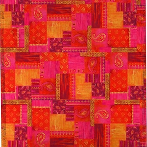 May include: A vibrant patchwork textile featuring a mix of red, orange, and pink hues. The design incorporates paisley and floral patterns within rectangular and square blocks. The edges have a fringed border, adding texture to the overall design.