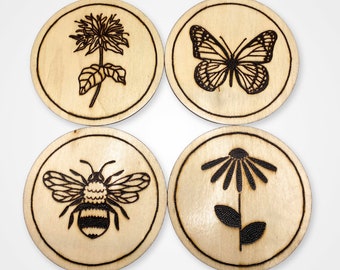 Set of handmade, wood burned pollinator and native wildflower silhouette coasters